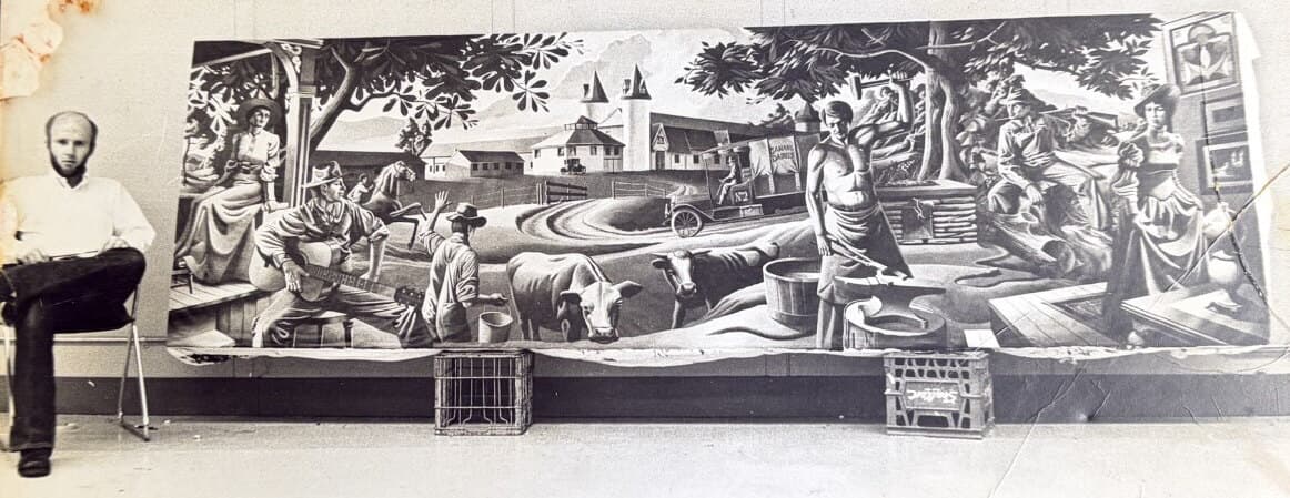 John Odell beside his 1973 mural for The Barn at Lucerne